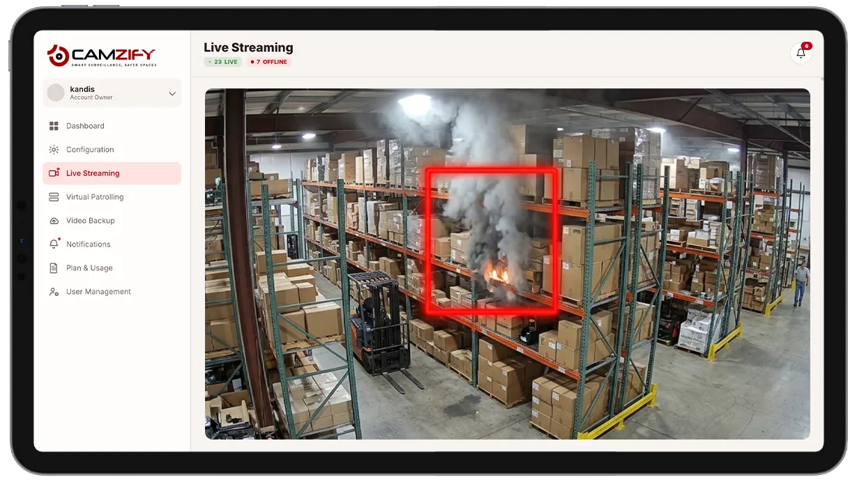 Camera view of a storage area with visible smoke highlighted by a detection bounding box