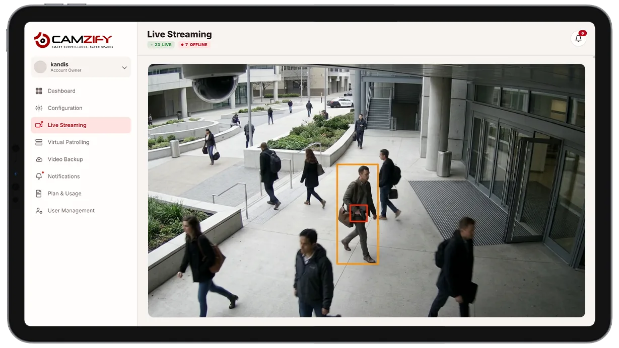 Camera view with a detected weapon highlighted by a bounding box and confidence score