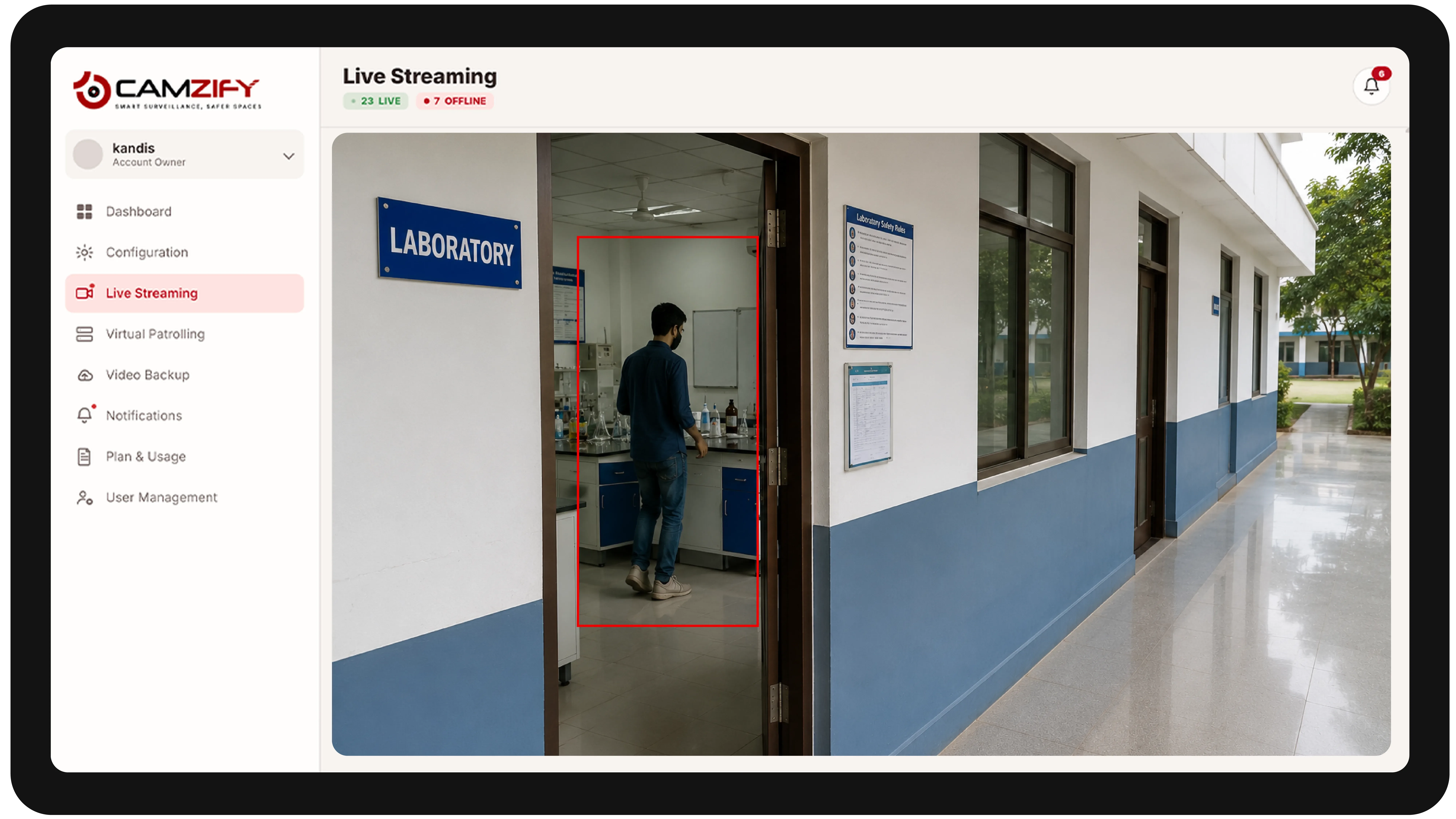 Live streaming from a education facility camera with people and vehicles outlined as they are tracked