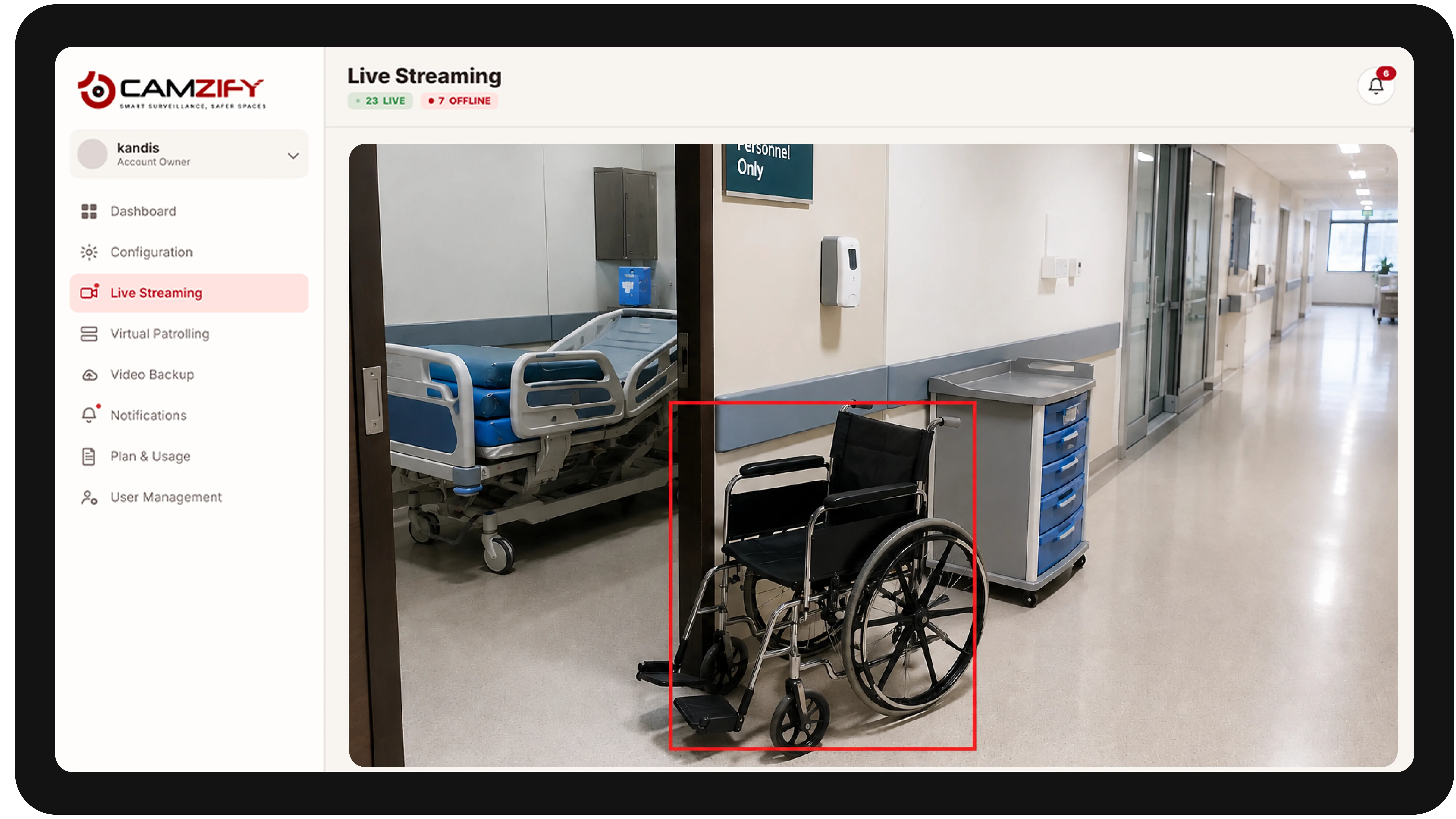 Live streaming from a healthcare facility camera with people and vehicles outlined as they are tracked