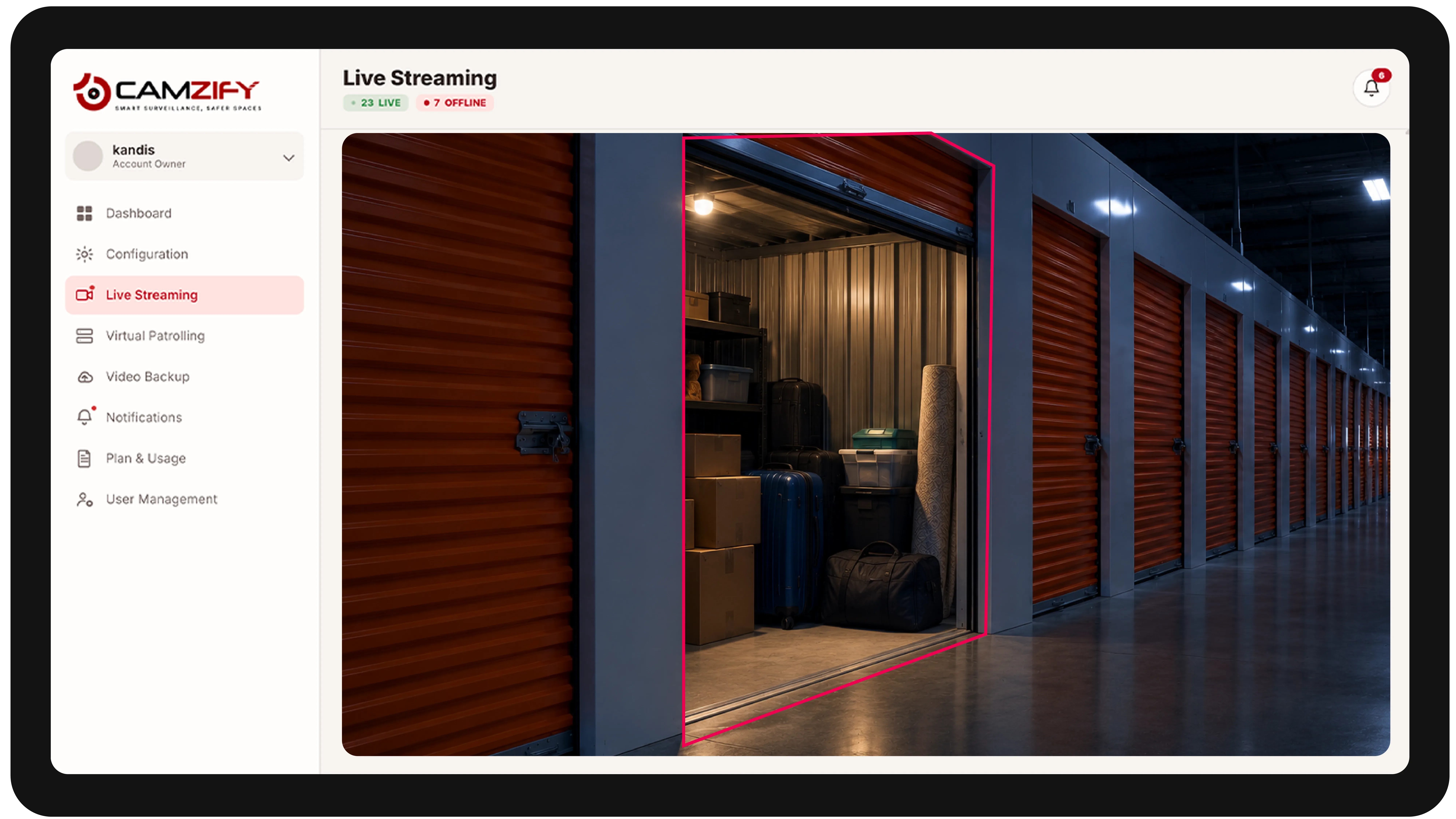 Live streaming from a self-storage camera with people and vehicles outlined as they are tracked