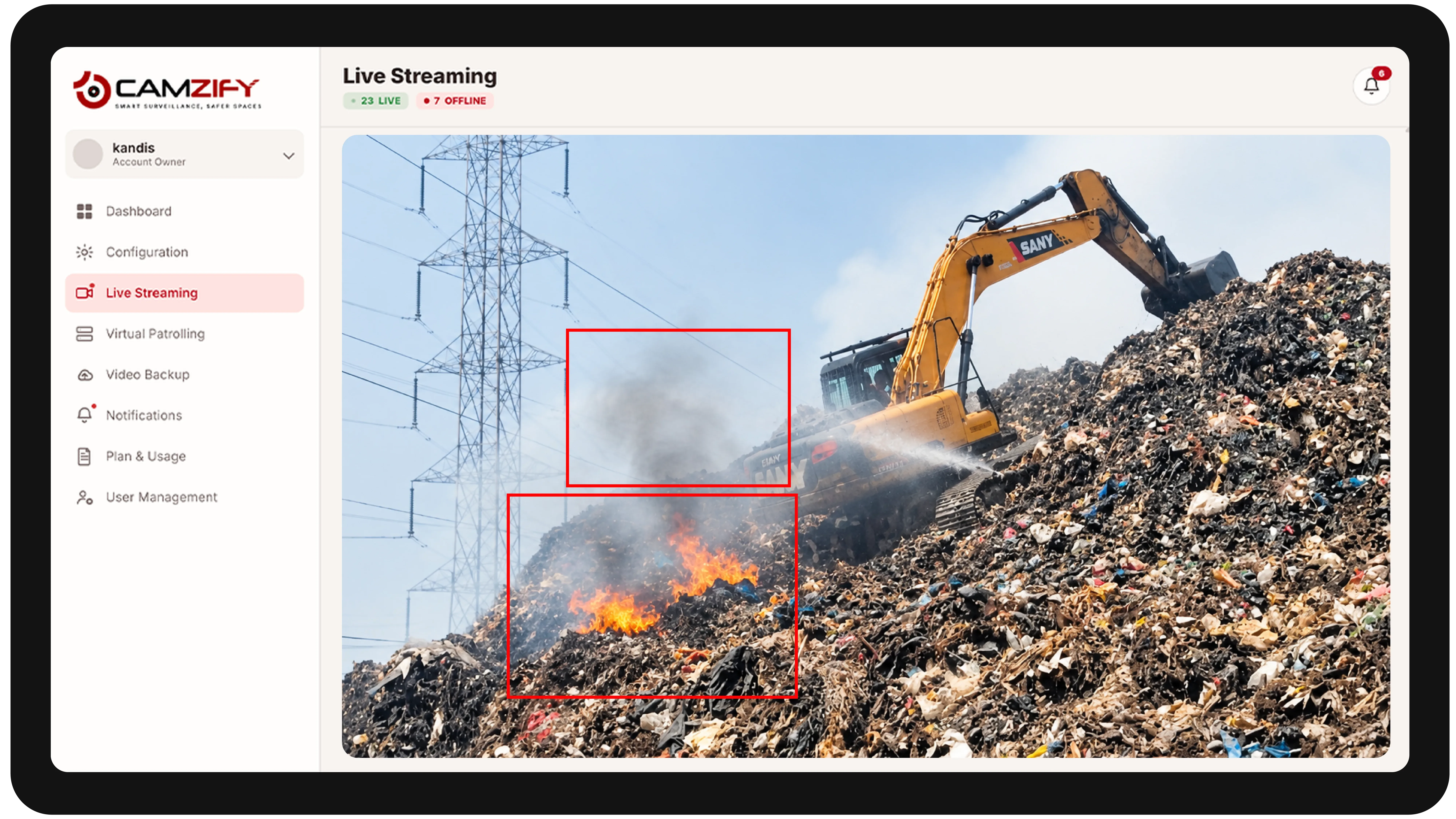 Live streaming from a waste management camera with people and vehicles outlined as they are tracked